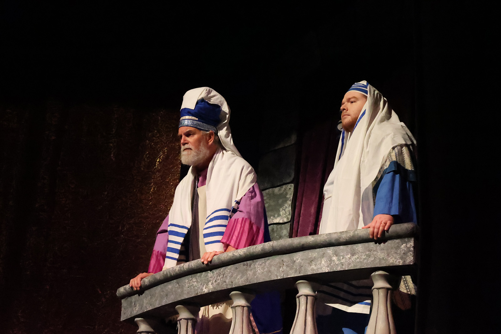 Men in clerical attire from biblical times gather in discussion.